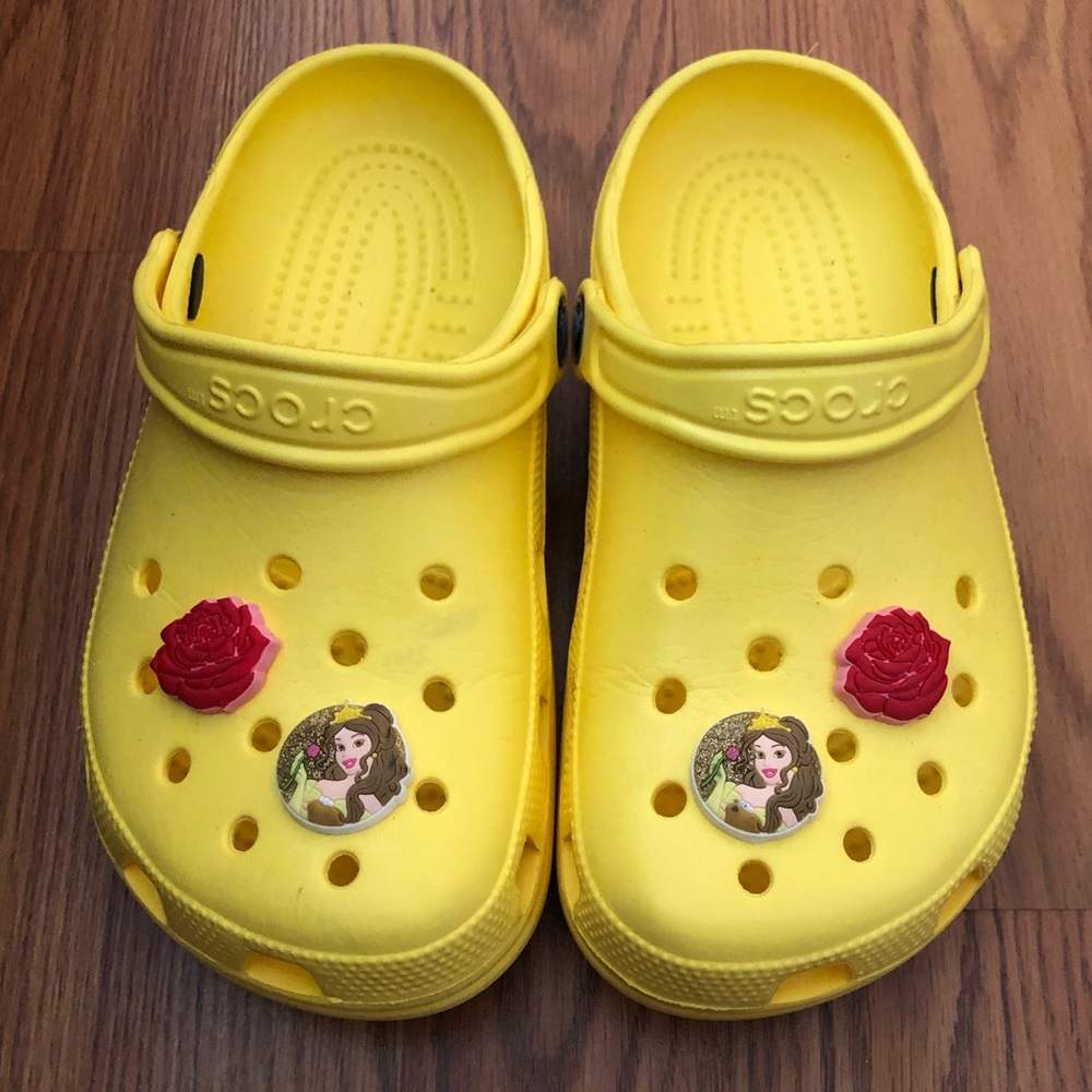Yellow crocs with Beauty and the Beast jibbetz